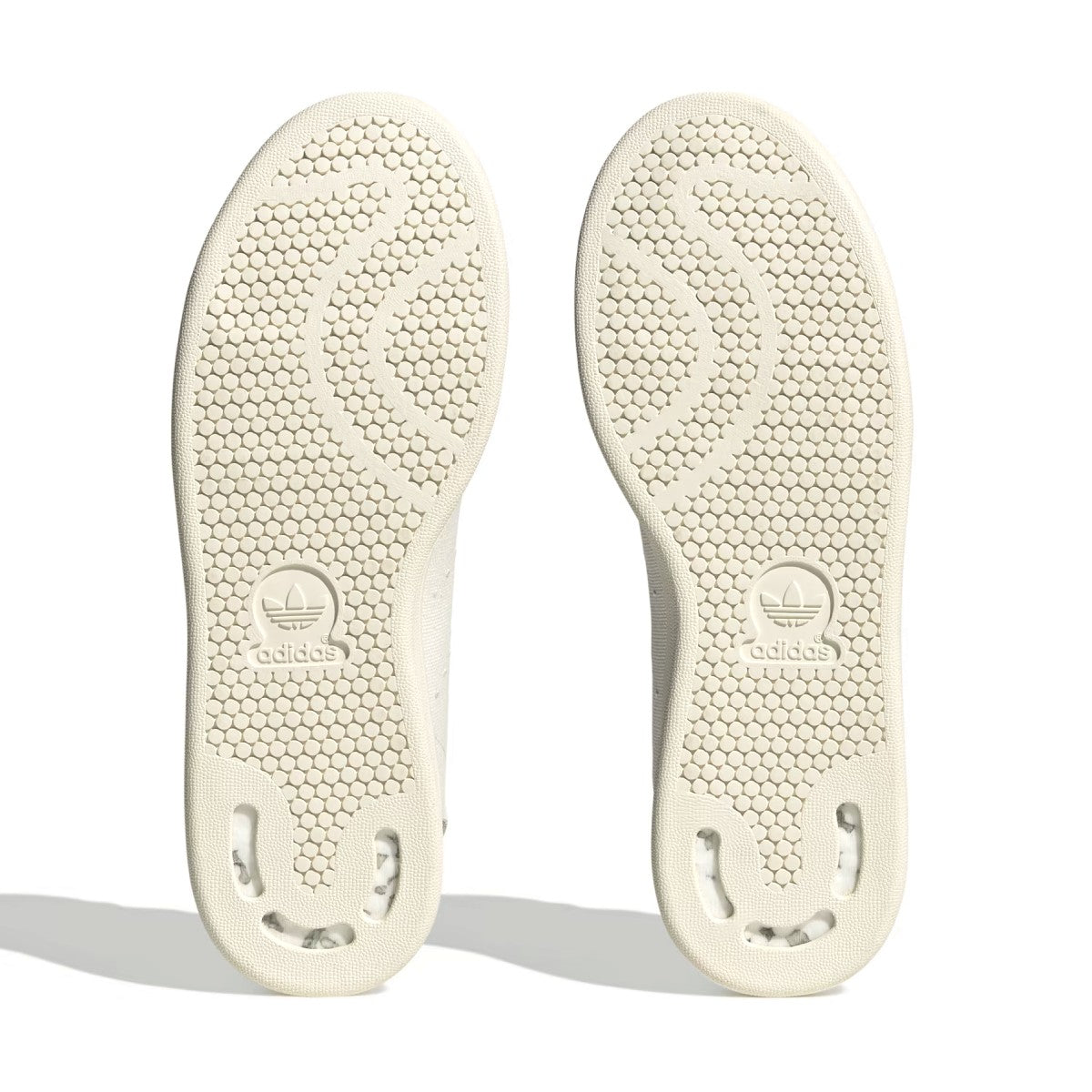 What's even better than recycled plastic? No plastic. That's why these shoes are made with nature. These adidas Stan Smith trainers bring together the best of both worlds, with the classic cues you've come to love (think perforation, simplicity and a low-profile silhouette) and natural materials like hemp, canvas and nubuck. The result is a handcrafted look marked by heavy stitch lines and a neutral palette. A natural rubber outsole offers grip and a smooth sign-off.