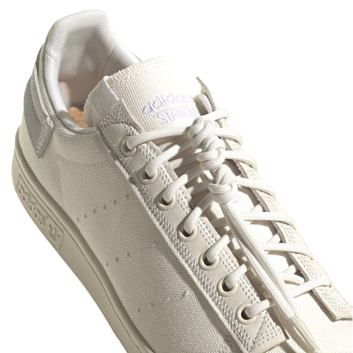 What's even better than recycled plastic? No plastic. That's why these shoes are made with nature. These adidas Stan Smith trainers bring together the best of both worlds, with the classic cues you've come to love (think perforation, simplicity and a low-profile silhouette) and natural materials like hemp, canvas and nubuck. The result is a handcrafted look marked by heavy stitch lines and a neutral palette. A natural rubber outsole offers grip and a smooth sign-off.