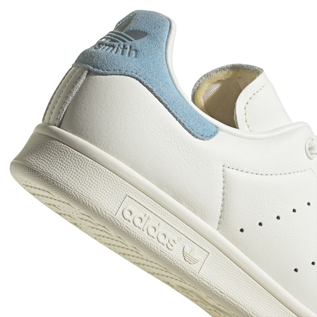 For decades, the adidas Stan Smith Shoes have reigned as the ultimate clean and crisp leather trainer. That clearly remains true today, with a smooth leather upper that embraces minimalism with signature perforated 3-Stripes. The pop of colour on the heel is classic Stan Smith -- matching the tongue label that shows the very man himself.