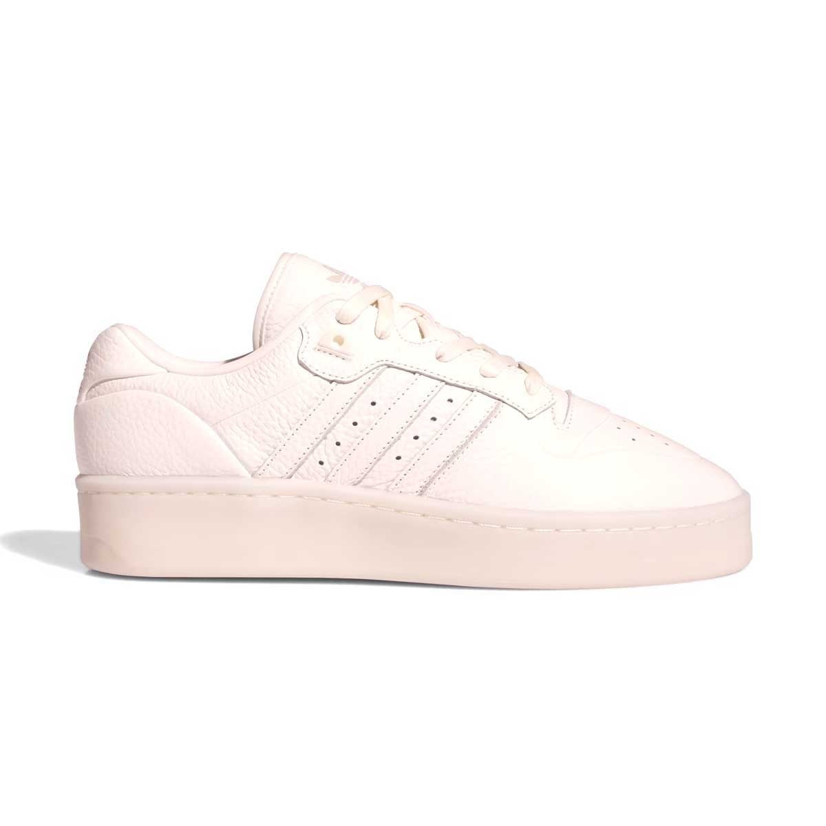 A B-ball icon, reimagined. These adidas Rivalry Lux Low shoes channel the prestige of '80s basketball in a modern mash-up with a premium leather upper and a semi-translucent rubber cupsole. From the sidewalks to the stadium, make a scene without saying a word. The 3-Stripes say it all.four