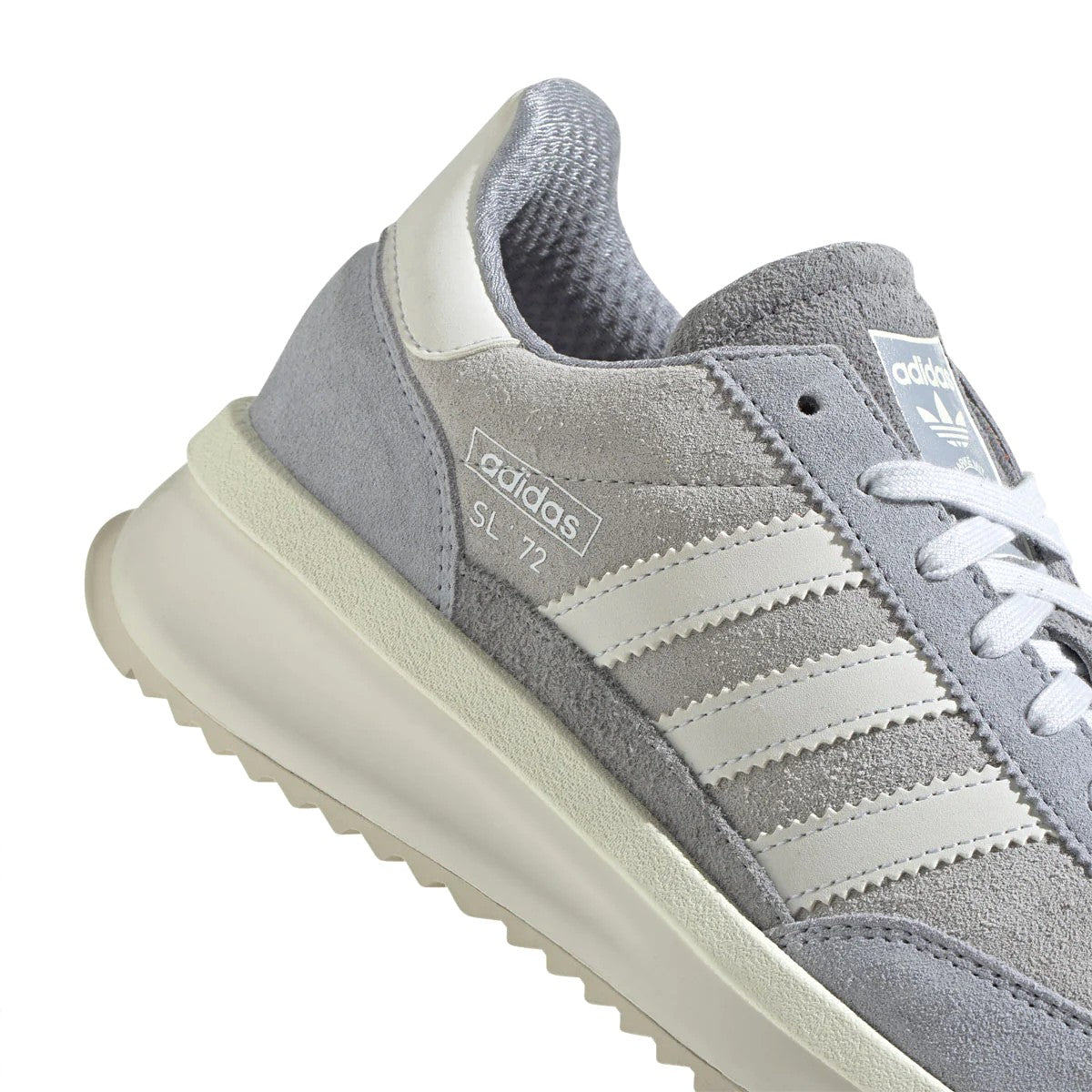 Originally a lightweight racing shoe — the adidas SL 72 trainers didn't only make an impression on any track, but at the track of the largest sporting event in history. Still super light, and still grounded in minimalism, this modern version rides on a combination gum and solid rubber outsole, and is finished with a durable mudguard and TPU heel clip for stability.