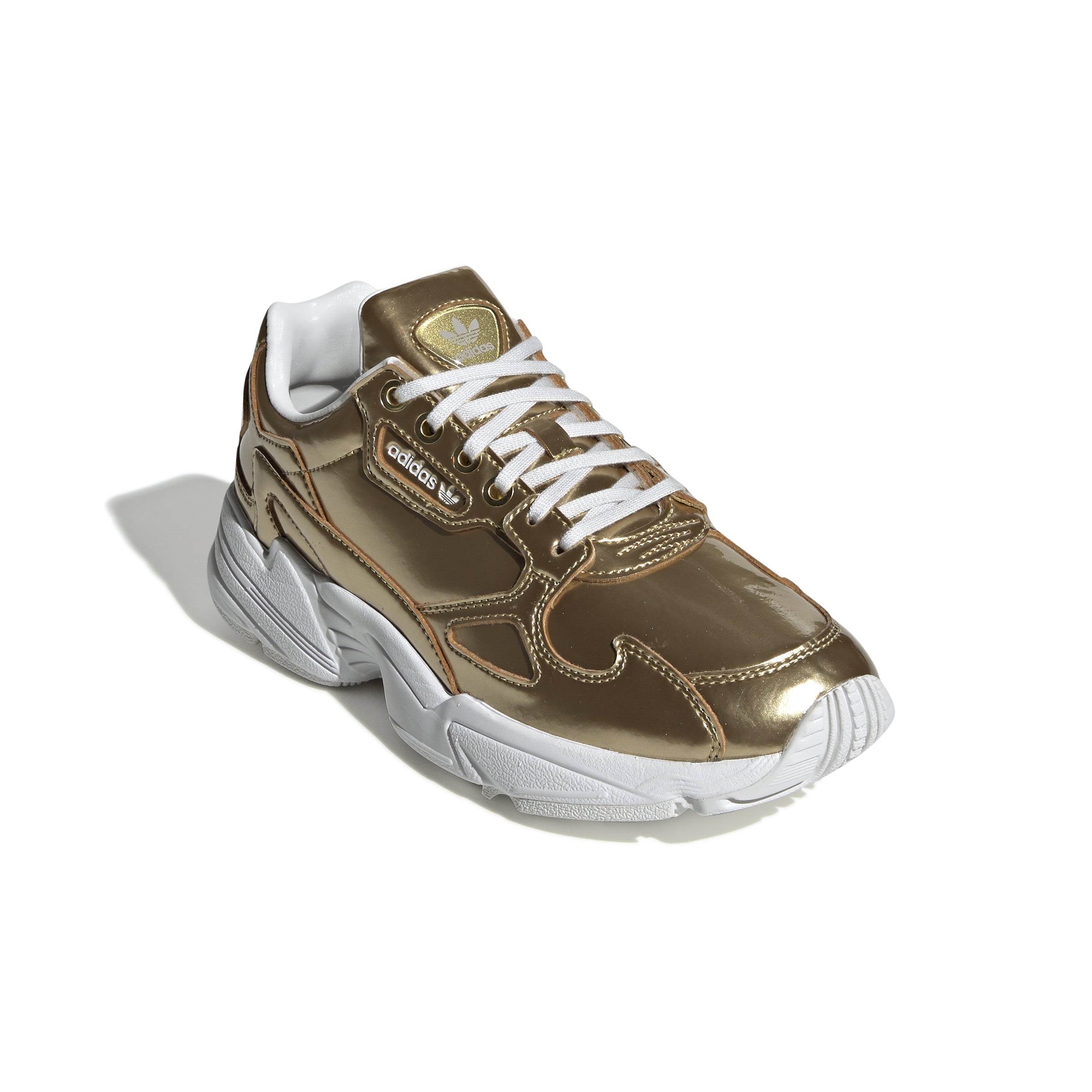 Confident '90s vibes inspire these throwback shoes. They shine bright with an eye-catching metallic synthetic upper. A contrast "X" on the outsole marks the Torsion System, a Falcon signature.