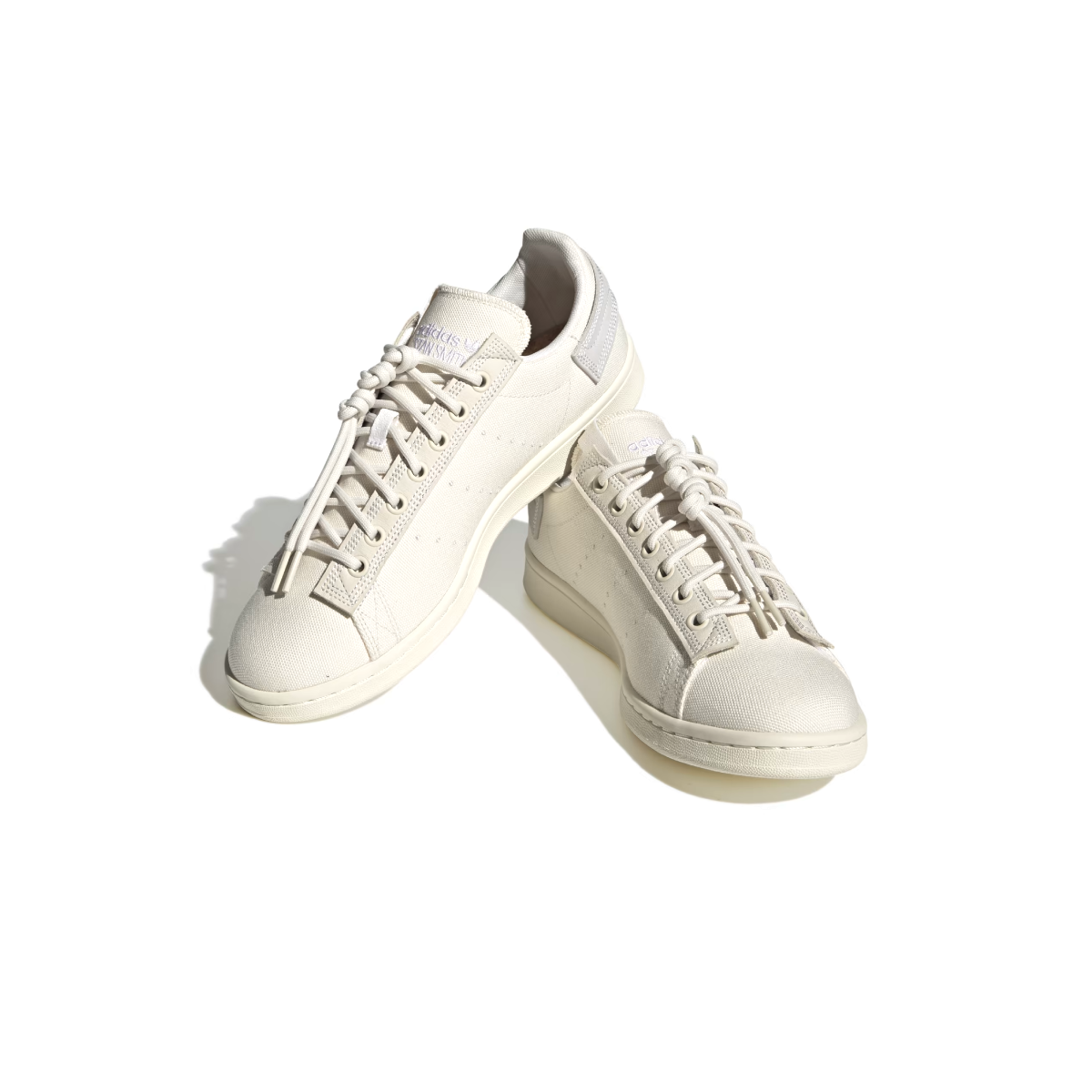 What's even better than recycled plastic? No plastic. That's why these shoes are made with nature. These adidas Stan Smith trainers bring together the best of both worlds, with the classic cues you've come to love (think perforation, simplicity and a low-profile silhouette) and natural materials like hemp, canvas and nubuck. The result is a handcrafted look marked by heavy stitch lines and a neutral palette. A natural rubber outsole offers grip and a smooth sign-off.