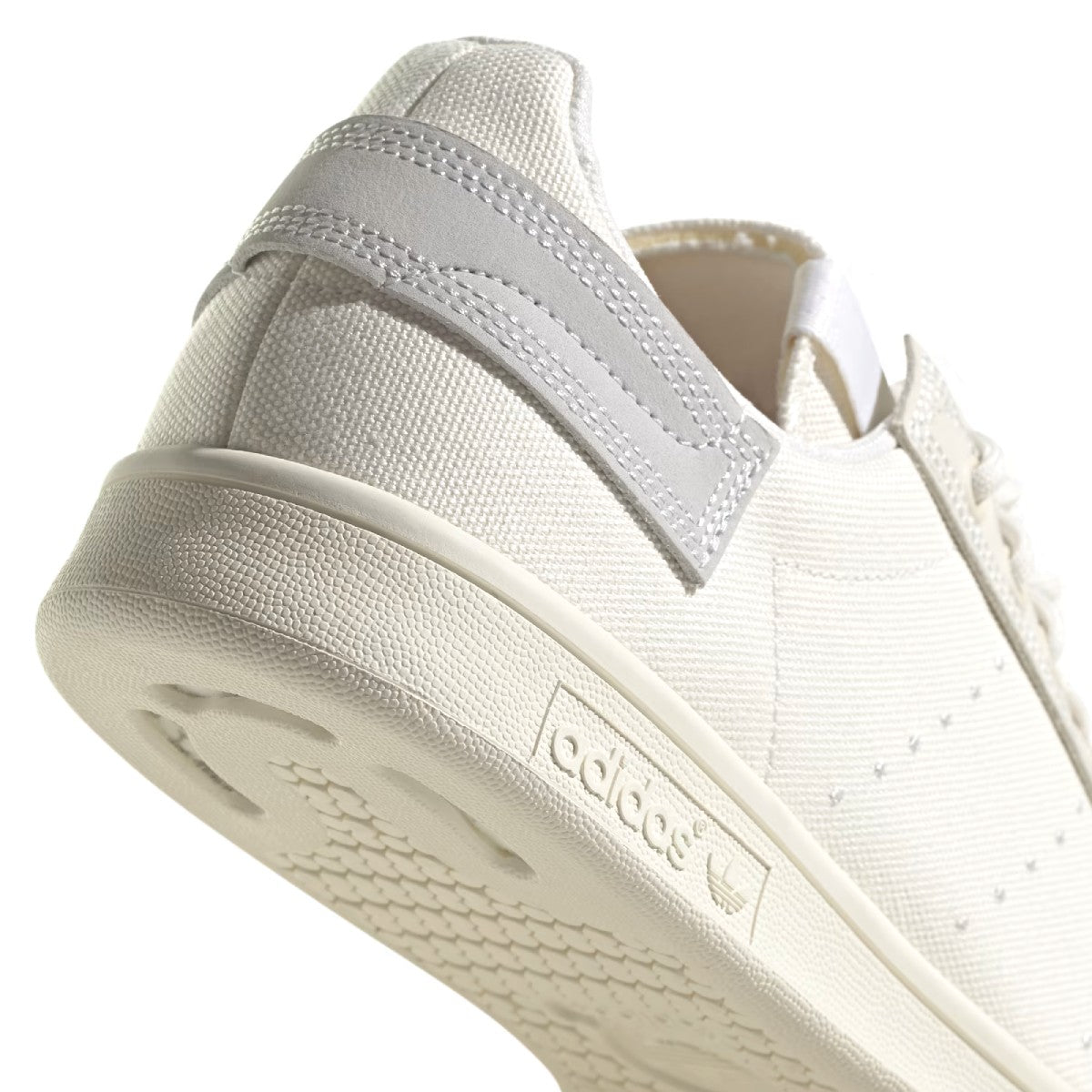 What's even better than recycled plastic? No plastic. That's why these shoes are made with nature. These adidas Stan Smith trainers bring together the best of both worlds, with the classic cues you've come to love (think perforation, simplicity and a low-profile silhouette) and natural materials like hemp, canvas and nubuck. The result is a handcrafted look marked by heavy stitch lines and a neutral palette. A natural rubber outsole offers grip and a smooth sign-off.