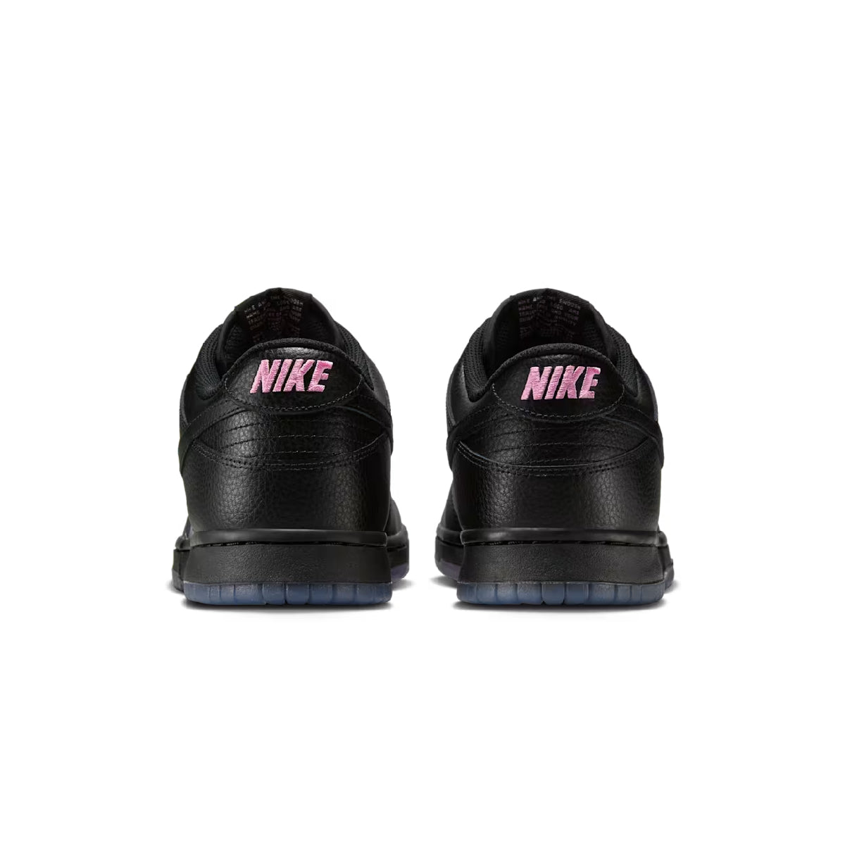 A pair of black Nike sneakers shown from the back, featuring a pink 'NIKE' logo on the heel and a dark blue outsole, set against a plain white background.
